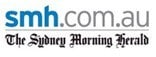 Logo for smh.com.au, The Sydney Morning Herald, with "smh" in blue and ".com.au" in gray above "The Sydney Morning Herald" in black cursive font.